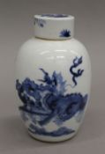 An 18th century Chinese blue and white porcelain tea caddy. 15 cm high.