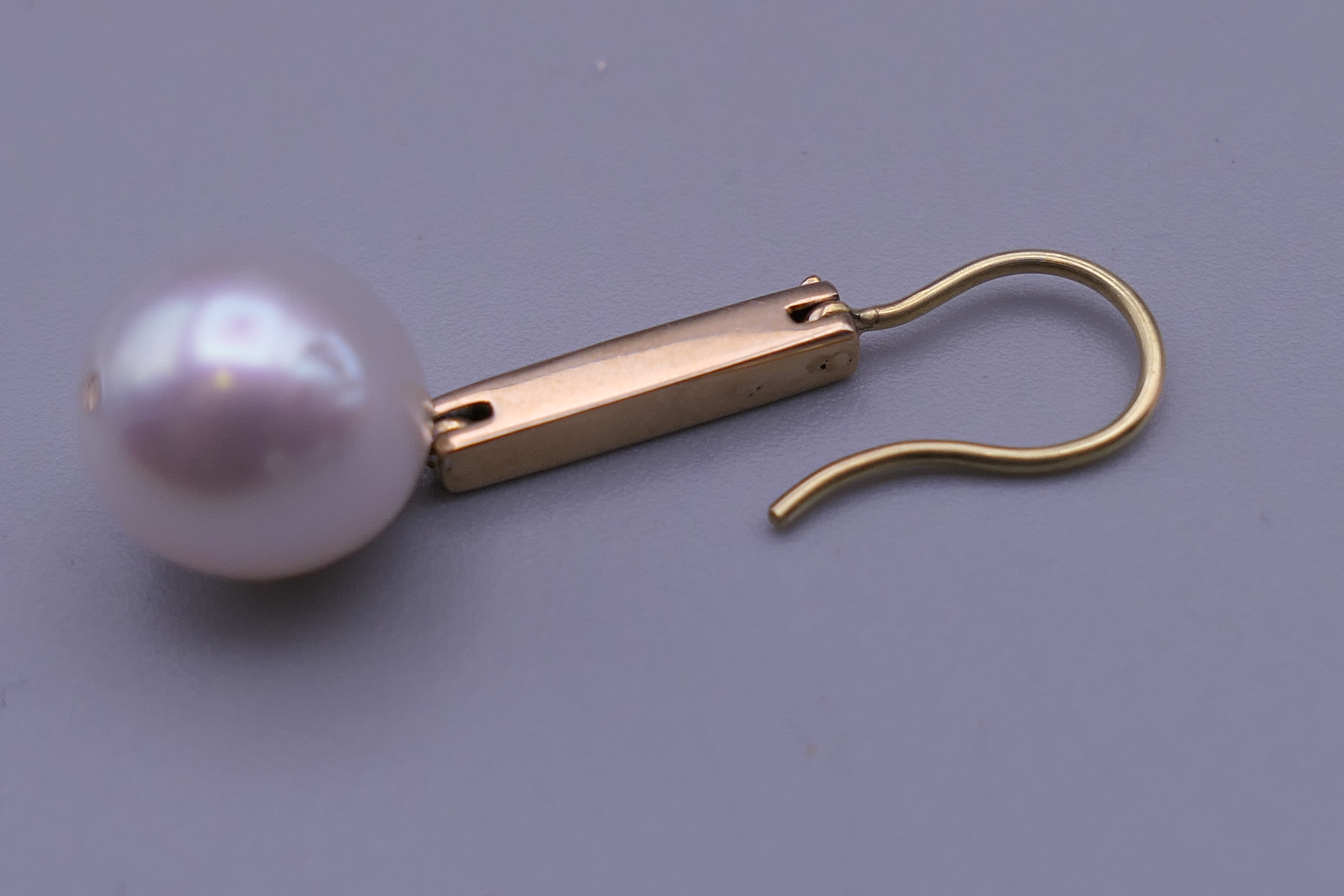 A pair of unmarked 18 K gold diamond and pearl earrings. 3.25 cm high. - Image 5 of 5