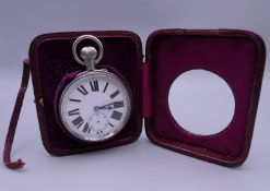 A Goliath pocket watch in case/night stand. The case 9.5 cm wide.