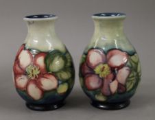 A pair of Moorcroft vases. 15 cm high.