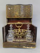 A 19th century Boulle tantalus box. 32 cm wide.