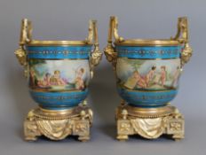 A pair of gilt mounted Sevres style painted porcelain jardiniere's. 33 cm high.