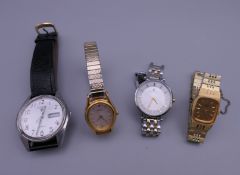 A gentleman's Pulsar wristwatch and three ladies wristwatches.