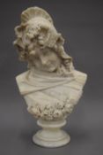 A late 19th century carved marble bust of a young lady on a socle base. 45 cm high.