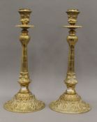 A large pair of brass candlesticks. 47 cm high.