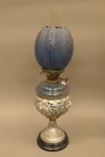 A Victorian oil lamp with blue glass reservoir and shade, possibly from an undertakers. 65.