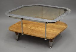 A Contemporary coffee table constructed from an aeroplane window. 76.5 cm long.