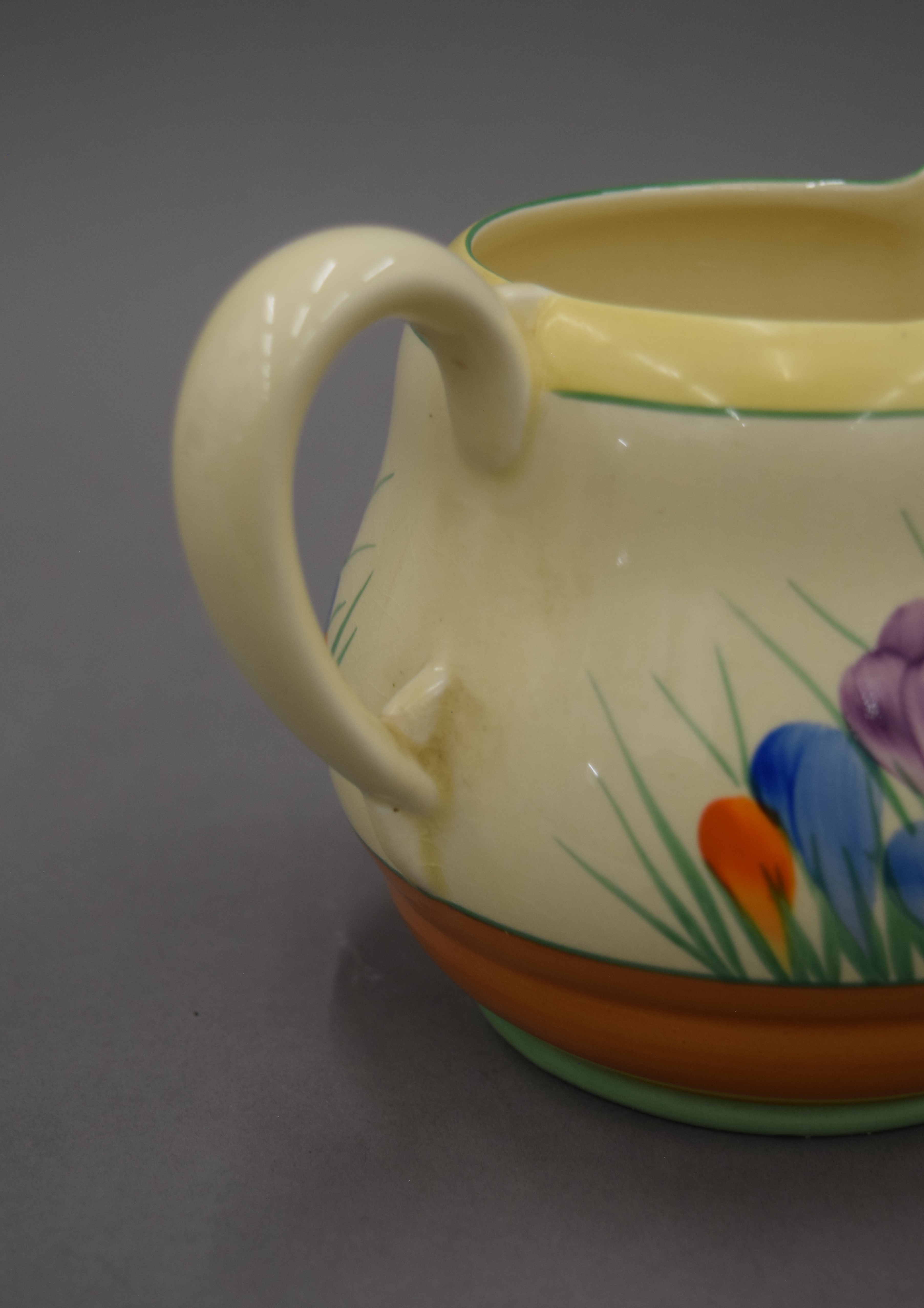 Three Clarice Cliff Crocus pattern jugs. The largest 12.5 cm high. - Image 3 of 8