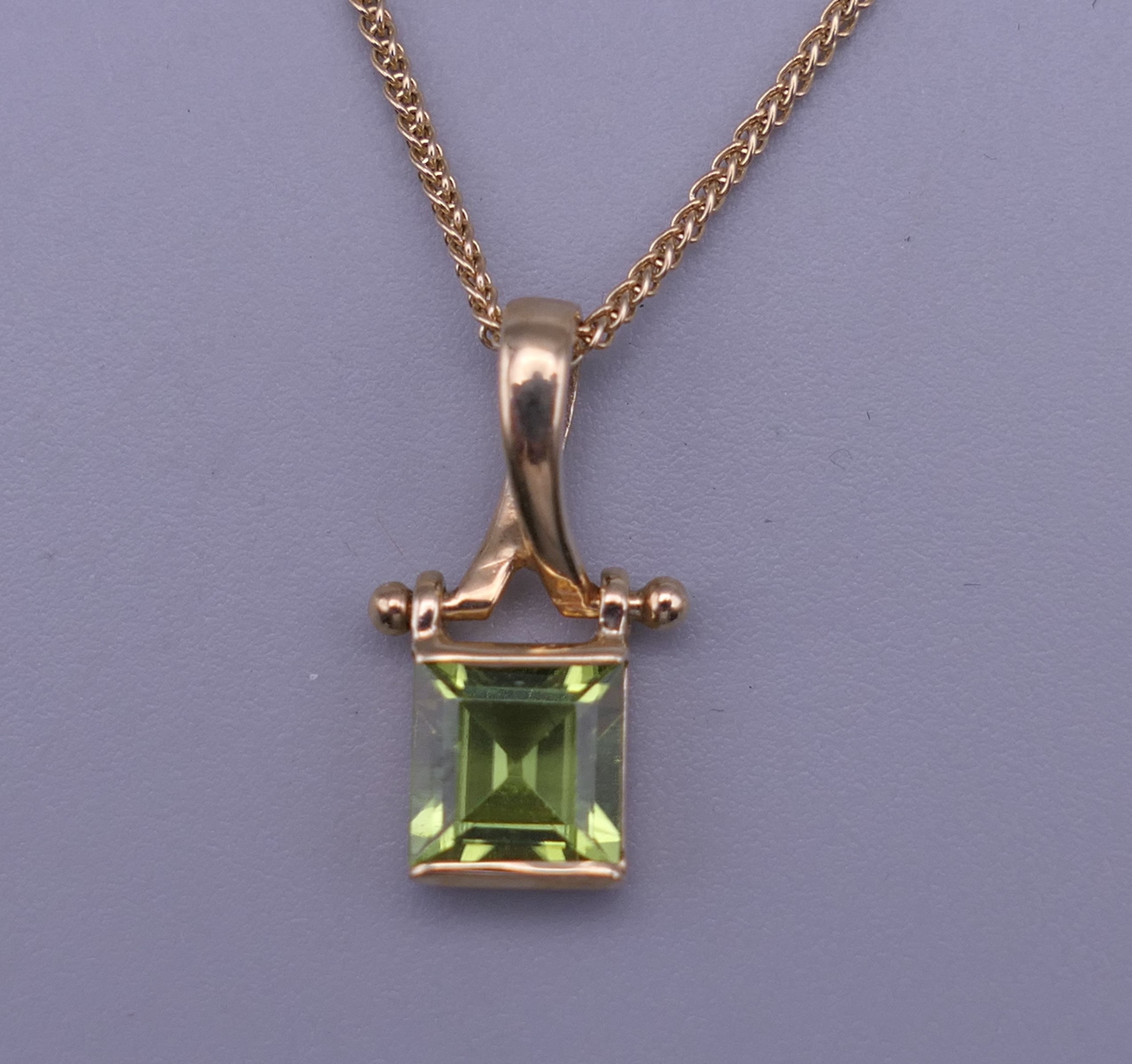 A 9 ct gold pendant necklace. The pendant 1.5 cm high.
