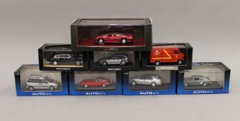 A box of Autoart die cast toys.