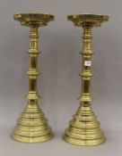 A pair of brass altar sticks. 53 cm high.