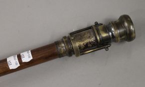 A compass and telescope walking stick. 97 cm long.
