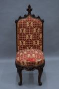 A Victorian carved oak upholstered hall chair. 121 cm high.