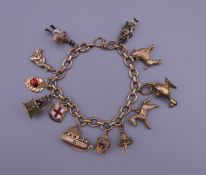 A 9 ct gold charm bracelet. 38.6 grammes total weight.