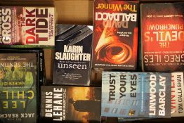 A large assortment of paperbacks and hardback books.