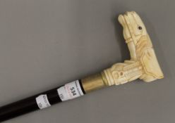 A walking stick with bone horse form handle. 95 cm long.