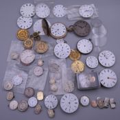 A quantity of various watch parts.