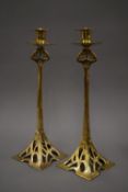 A pair of tall Art Nouveau style brass candlesticks. 37 cm high.