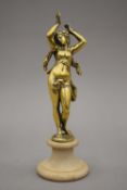 A 19th century polished bronze female nude on a later base. 25 cm high.