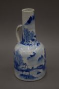 An 18th century Chinese blue and white porcelain ewer. 25 cm high.