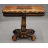 A 19th century rosewood card table. 91 cm wide.