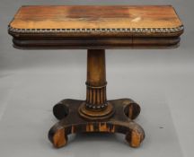 A 19th century rosewood card table. 91 cm wide.