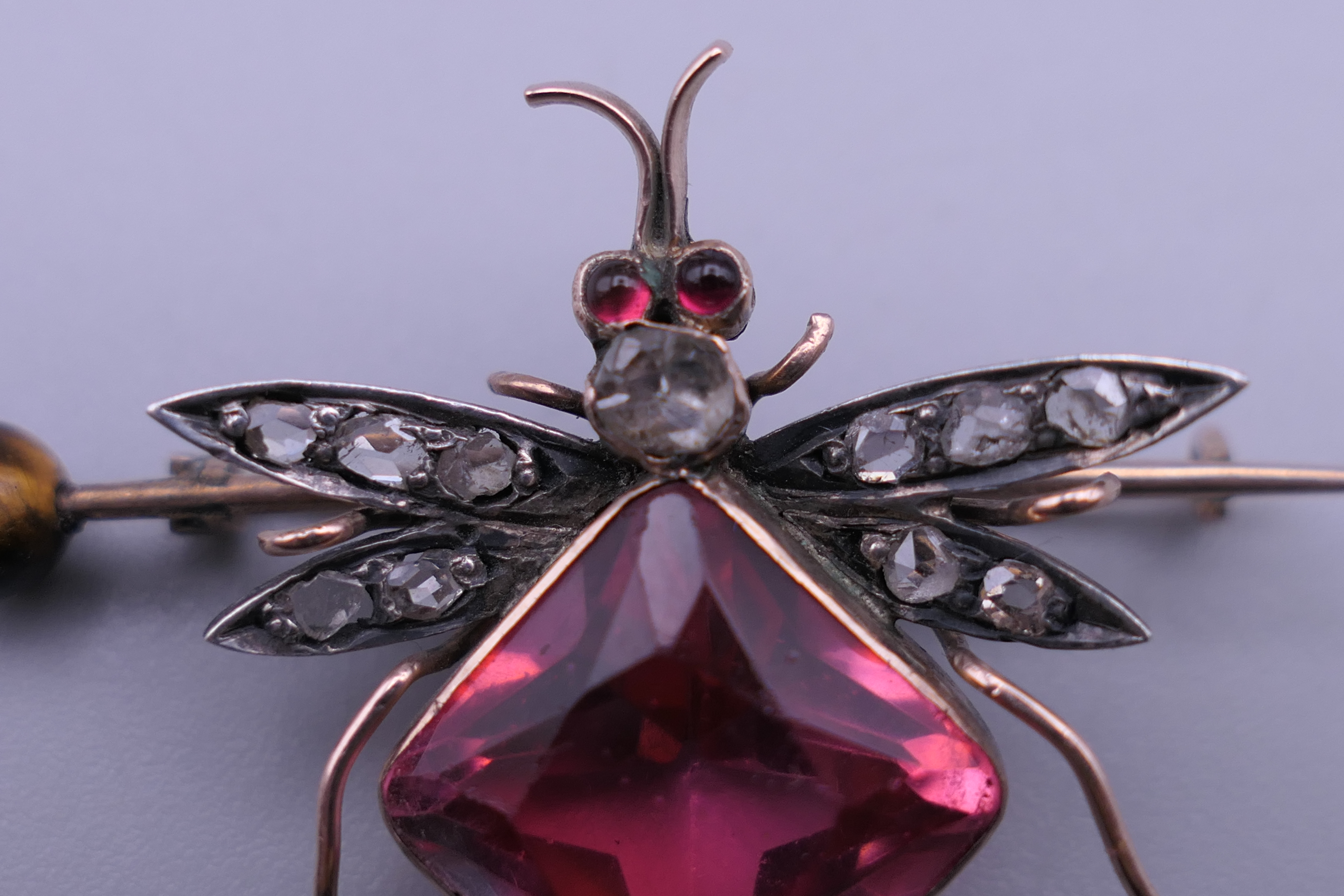 An unmarked gold diamond set bee brooch. 4 cm wide. - Image 5 of 7