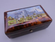 A Victorian eglomise and tortoiseshell box, the lid depicting The Crystal Palace. 9 cm wide.