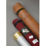 A leather rod case, an Orvis canvas rod case and an aluminium rod case.