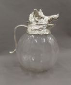 A silver plated boar's head formed claret jug. 27 cm high.