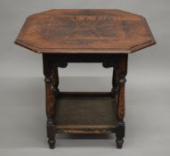 A Victorian carved oak centre table.