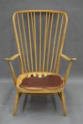 A blonde Ercol armchair. 73 cm wide.