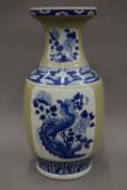 A 19th century Chinese porcelain vase with ribbed celadon body with panels,