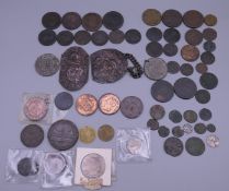 A collection of various coins and two sections of a buckle.