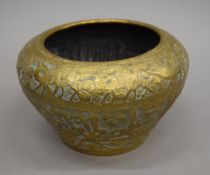 An embossed Eastern brass jardiniere. 14 cm high.