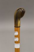 A 19th century malacca walking stick with horn (possibly rhino horn) handle. 90.5 cm long.
