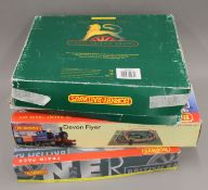 Three boxed Hornby railway sets.