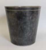 A blue leather wastepaper bin. 30 cm high.