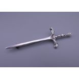A silver kilt pin formed as a sword. 8.5 cm long.
