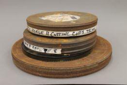 A quantity of 16 mm film reels in original cans and loose with editing notes,