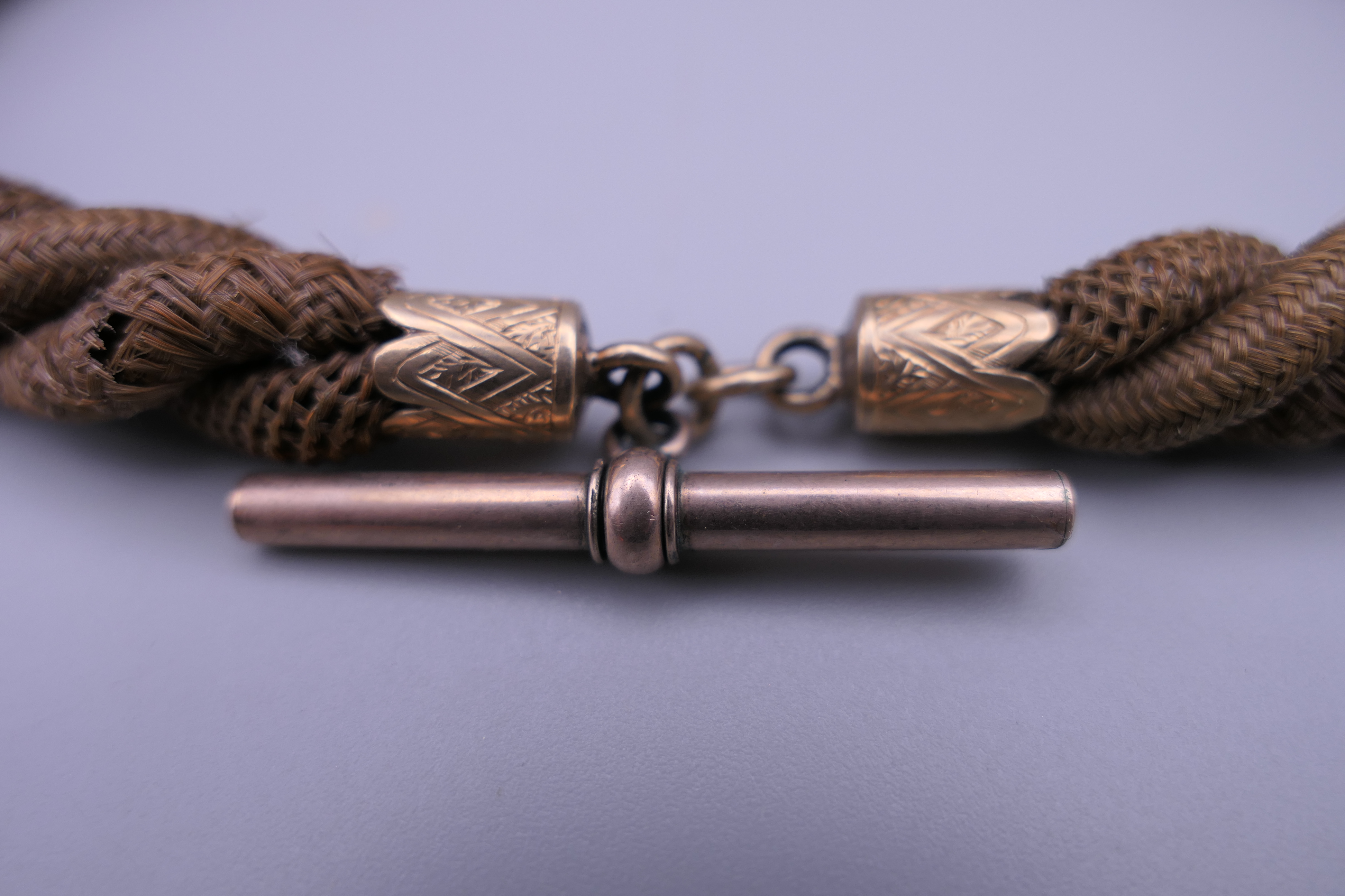 A Victorian 9 ct gold mounted hair twist watch chain. Approximately 36 cm long. - Image 2 of 5