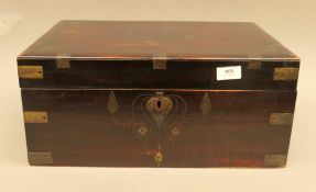 A 19th century brass inlaid Anglo Indian travelling box, partially fitted. 44.5 cm wide.