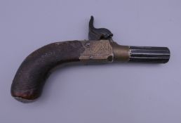A small 19th century pocket pistol engraved ''Green London''. 12 cm long.