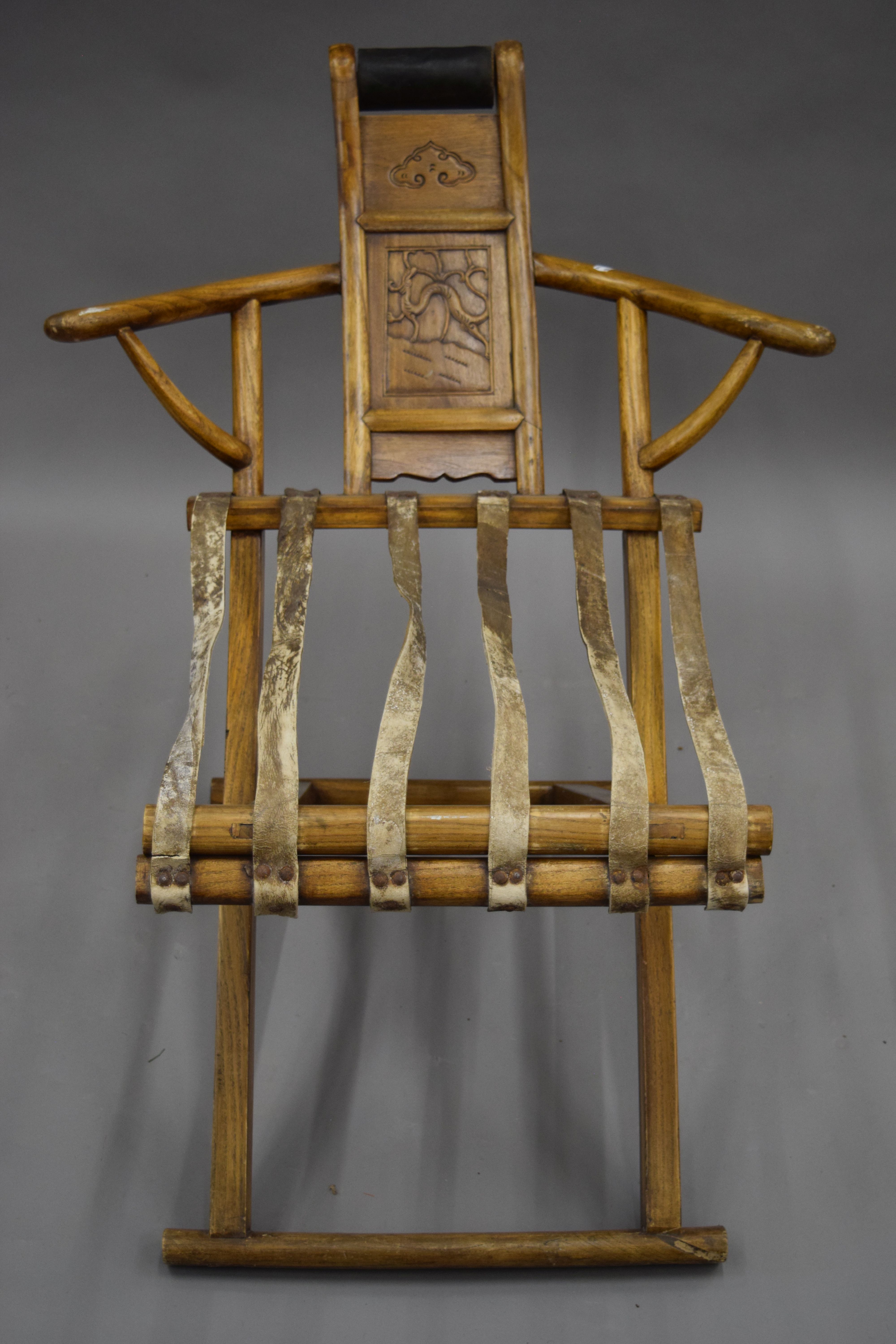 A Chinese elm folding chair. 74.5 cm wide.