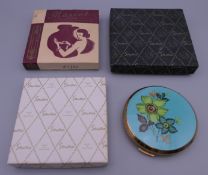 A small collection of vintage compacts.