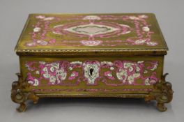 A 19th century French mother-of-pearl and ivory inlaid brass clad ormolu mounted box. 22 cm wide.