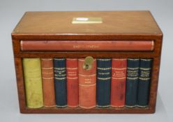 A 1950's Dunhill walnut and faux book cigar humidor. 30.5 cm wide.