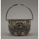 An embossed silver sugar bowl. 10.5 cm wide. 125.8 grammes.