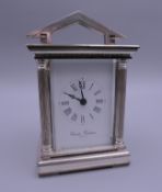 A modern silver cased Charles Frodsham miniature carriage clock. 10 cm high.