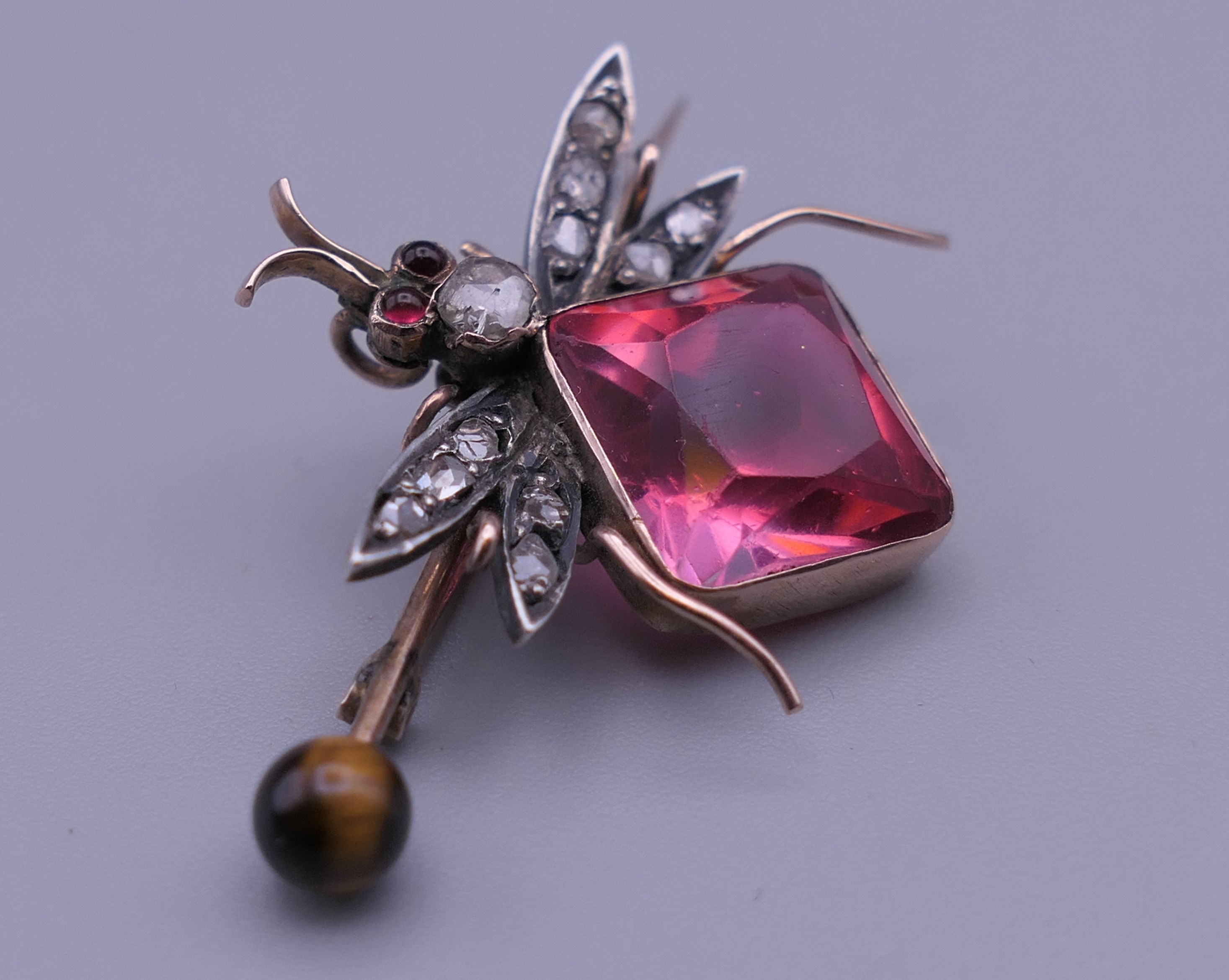 An unmarked gold diamond set bee brooch. 4 cm wide. - Image 3 of 7